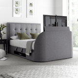 An ottoman bed frame with a grey upholstered headboard and an enclosed Tv space, featuring storage space beneath.